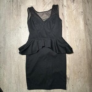 Black peplum bodycon dress with mesh back and zipper detail. Size: S
